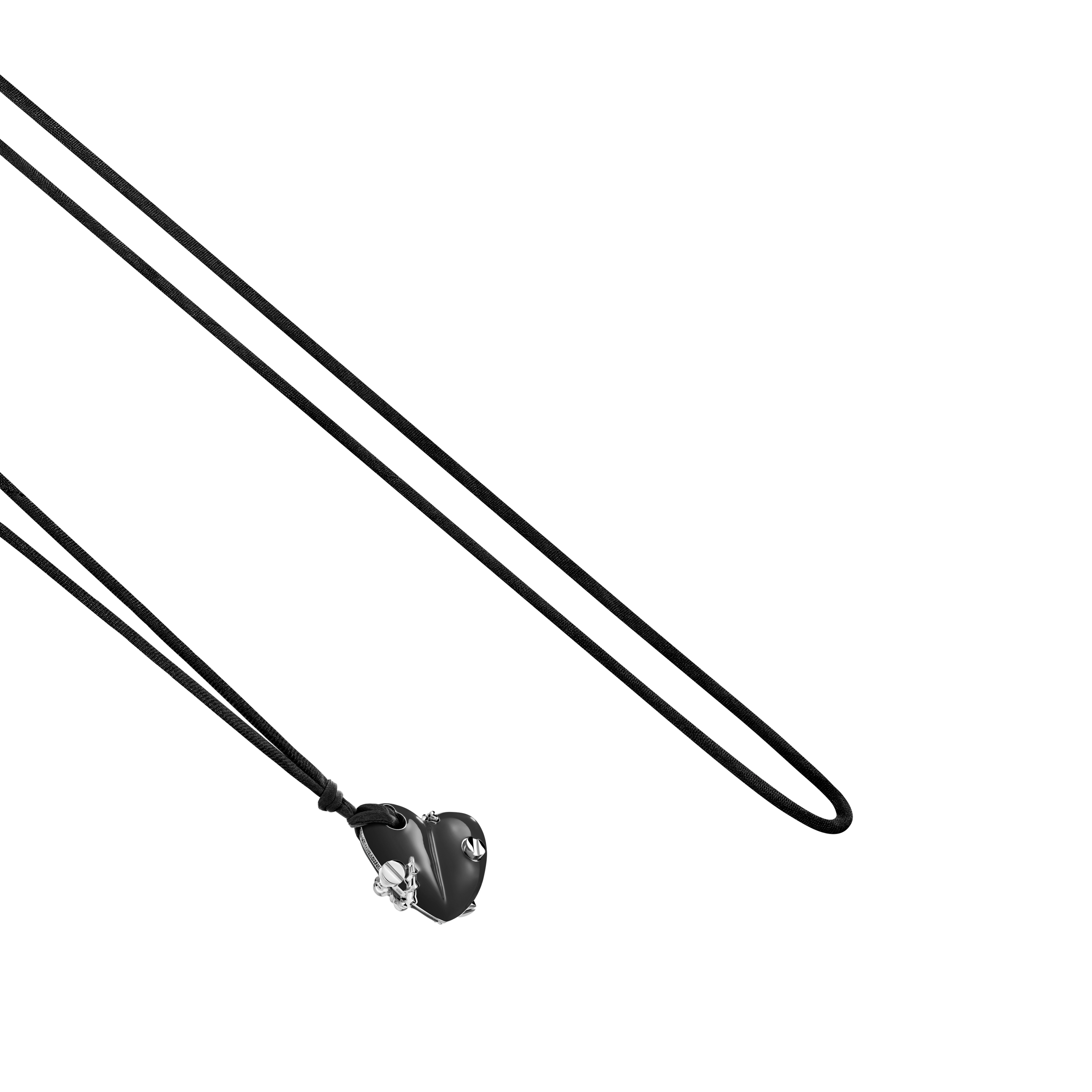 A detail view of Bullet Hole Heart Pendant with Screws