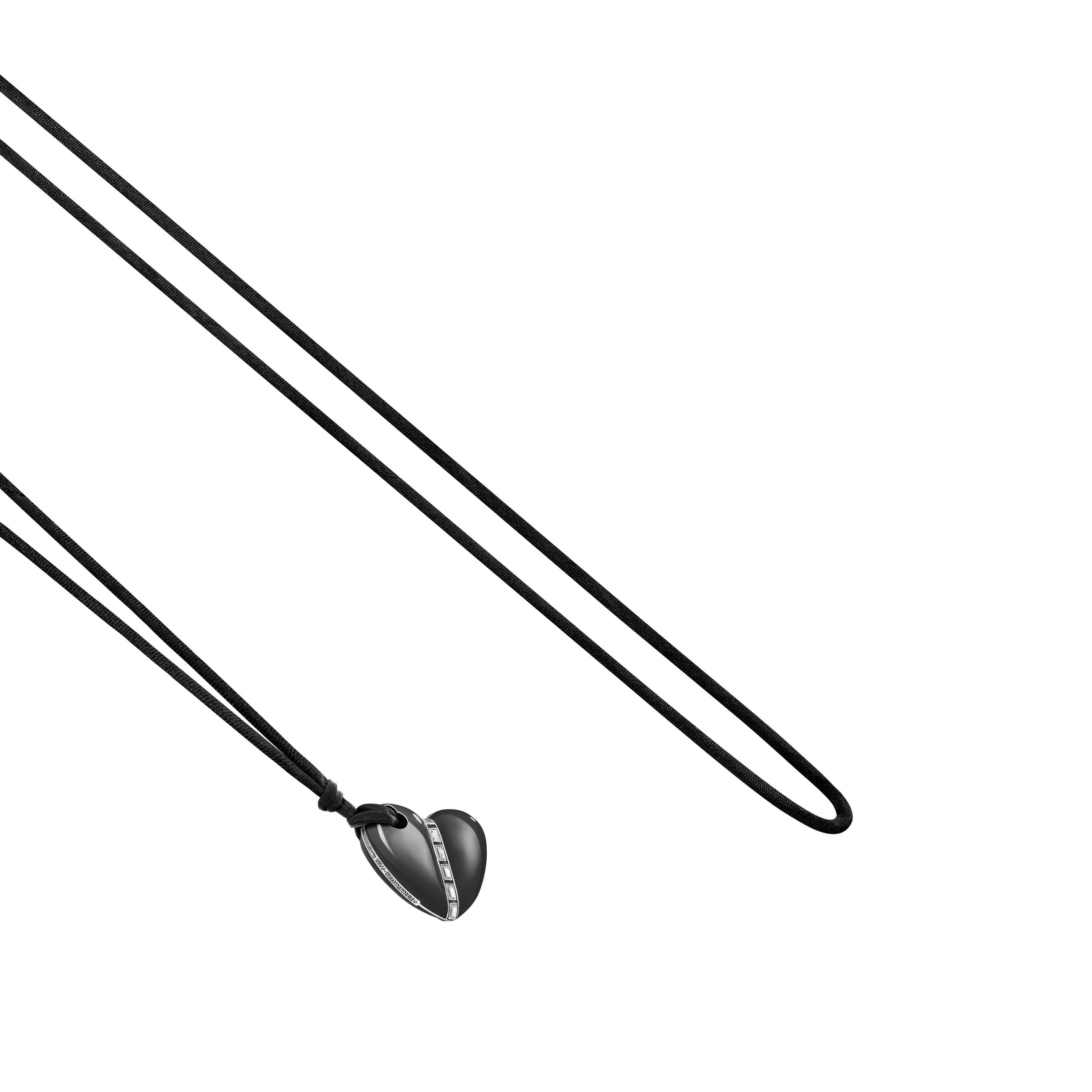 A detail view of Bullet Hole Heart Pendant with Baguettes